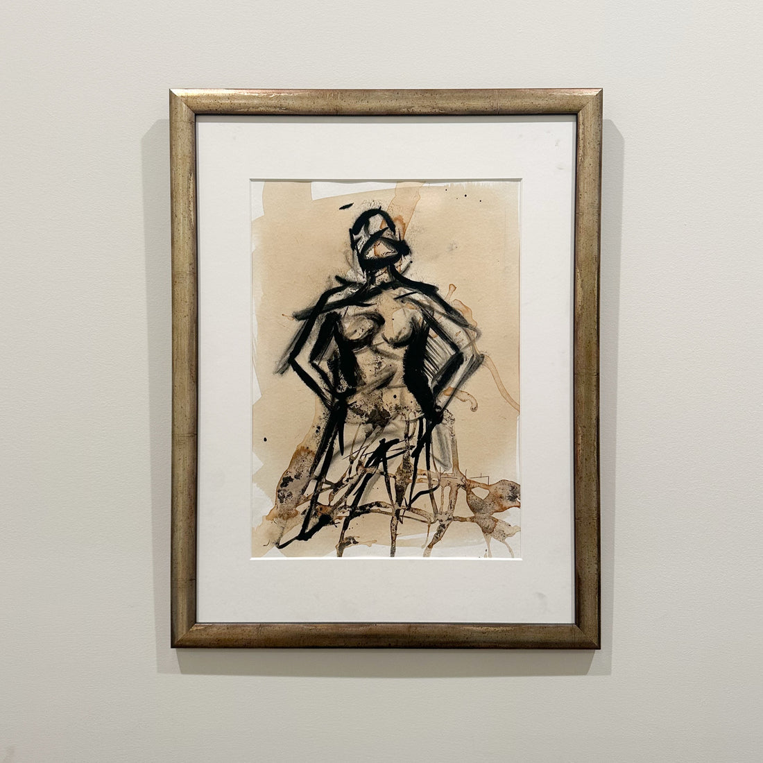 Framed coffee and ink figure