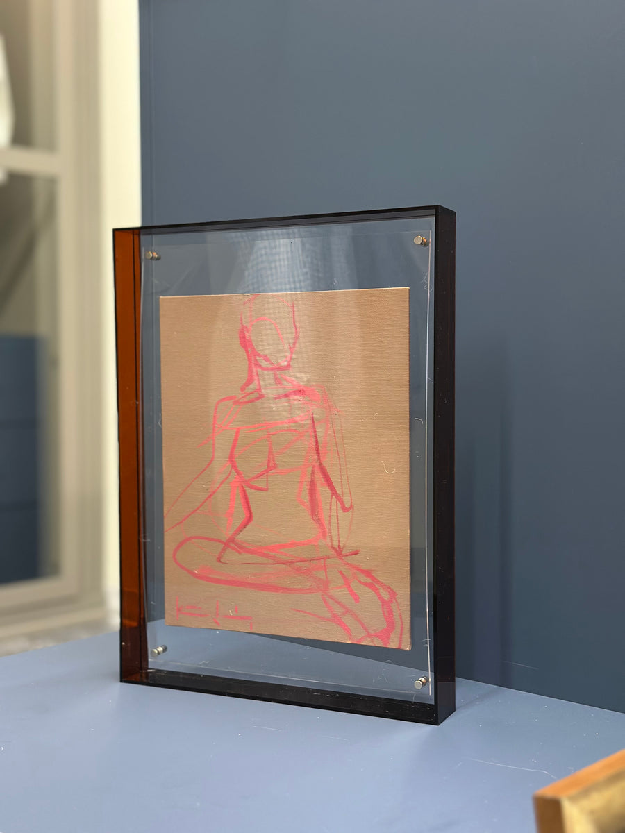 Framed figure in acrylic frame